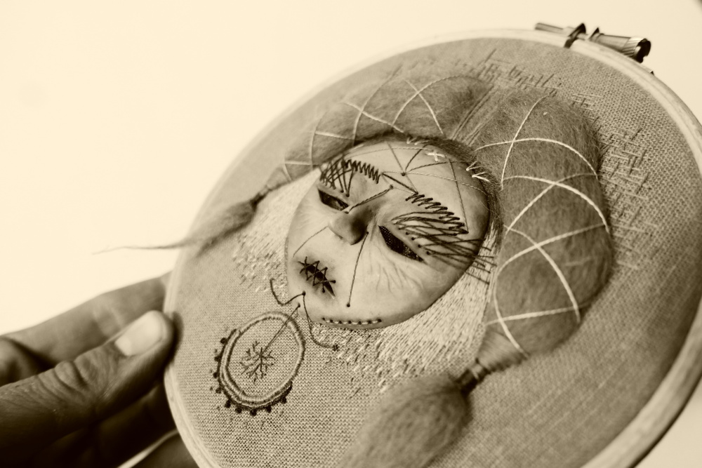 Hand embroidered mask with hair