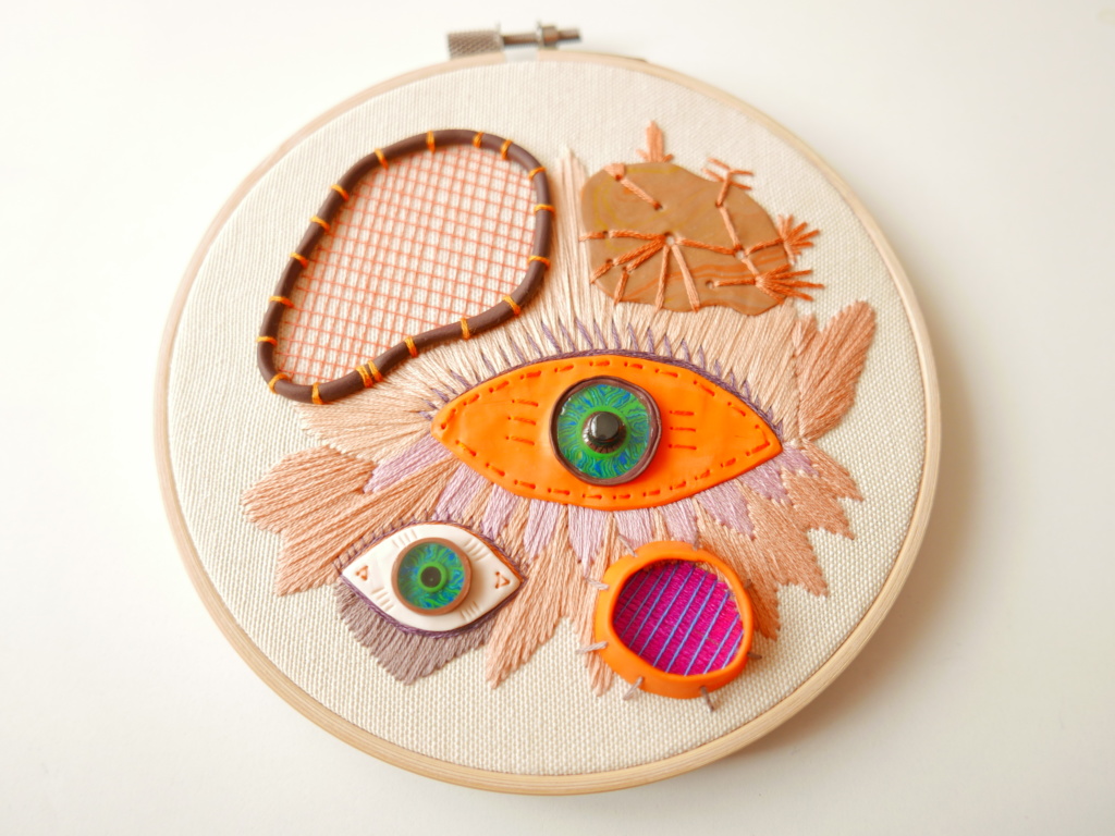 hand embroidered hoop with orange eye