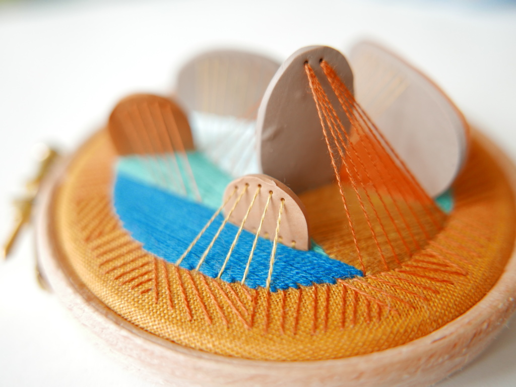 tiny polymer clay tiles stitched to a hoop