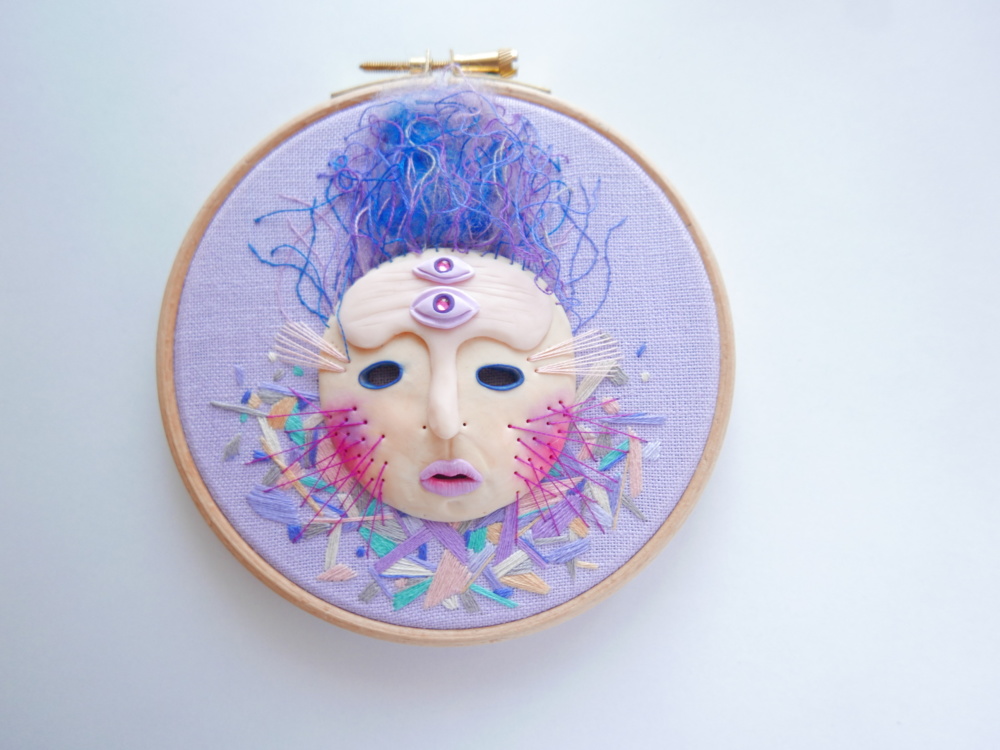 hand embroidered mask on a hoop