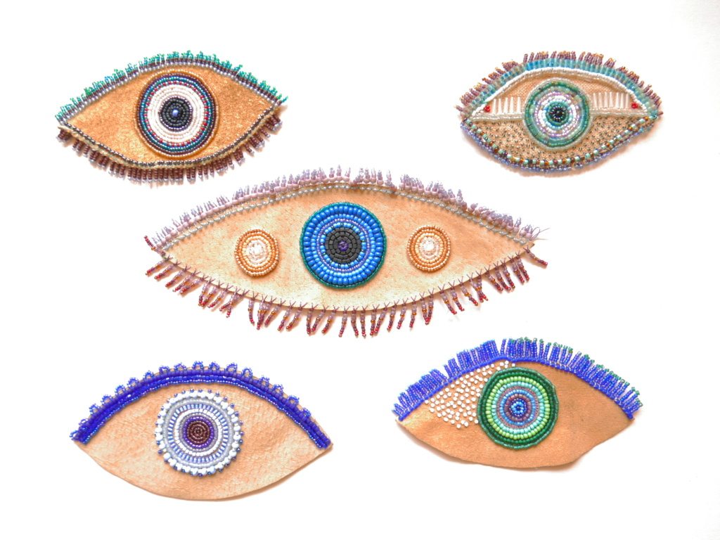 hand beaded eyes on recycled leather